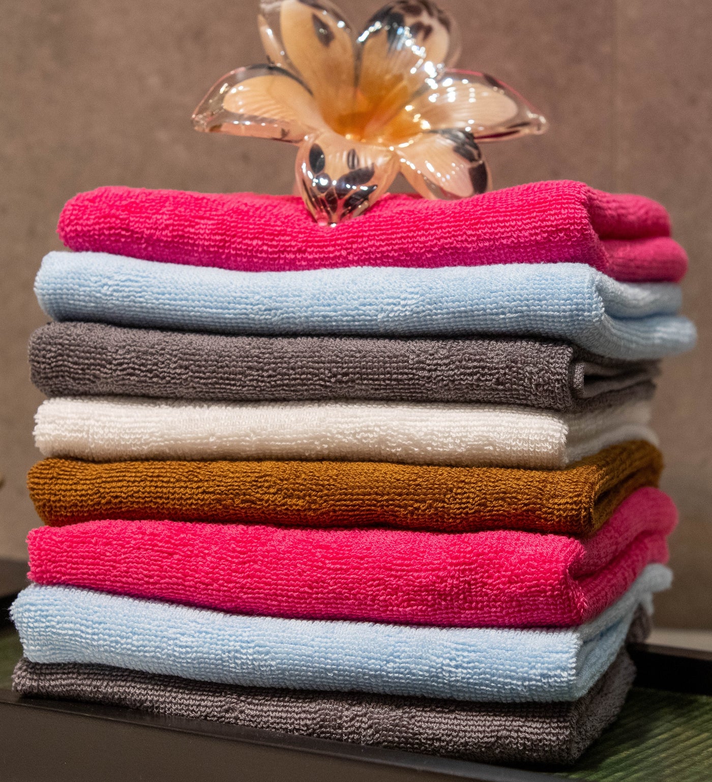 Stack of folded colourful Linen Harbour towels